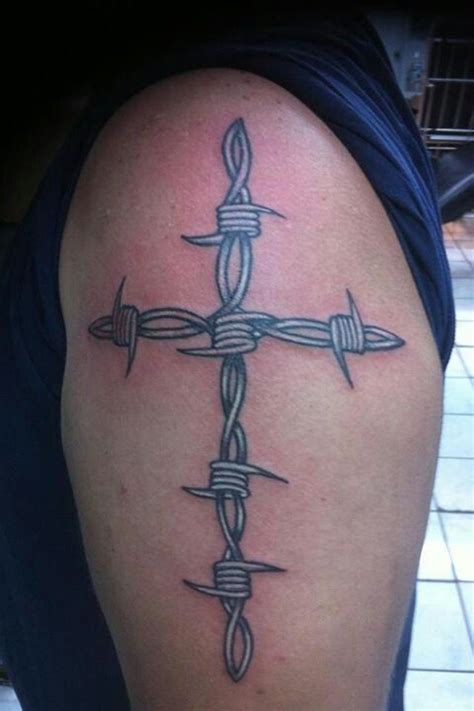 barbwire tattoo designs|cross with barbed wire tattoo.